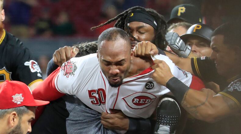 Amir Garrett of the Cincinnati Reds engages members of the Pittsburgh Pirates during a bench clearing altercation in the 9th inning of the game at Great American Ball Park on July 30, 2019 in Cincinnati, Ohio. (Photo by Andy Lyons/Getty Images)
