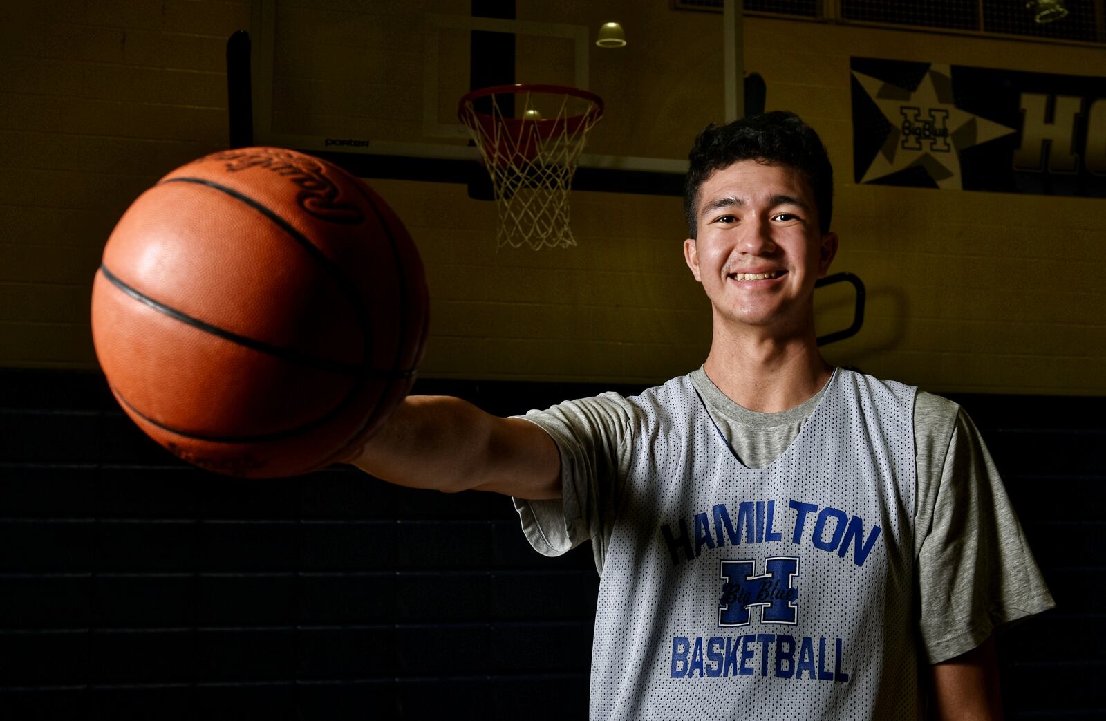 Sage Tolentino, a 210-pound, 7-foot junior from Hawaii is playing basketball for Hamilton High School this season. Tolentino ended up in Hamilton after sports in Hawaii were cancelled due to the coronavirus. He has verbally committed to play college basketball for Bruce Pearl at Auburn University. NICK GRAHAM / STAFF