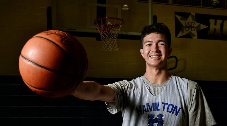 Sage Tolentino, a 210-pound, 7-foot junior from Hawaii is playing basketball for Hamilton High School this season. Tolentino ended up in Hamilton after sports in Hawaii were cancelled due to the coronavirus. He has verbally committed to play college basketball for Bruce Pearl at Auburn University. NICK GRAHAM / STAFF