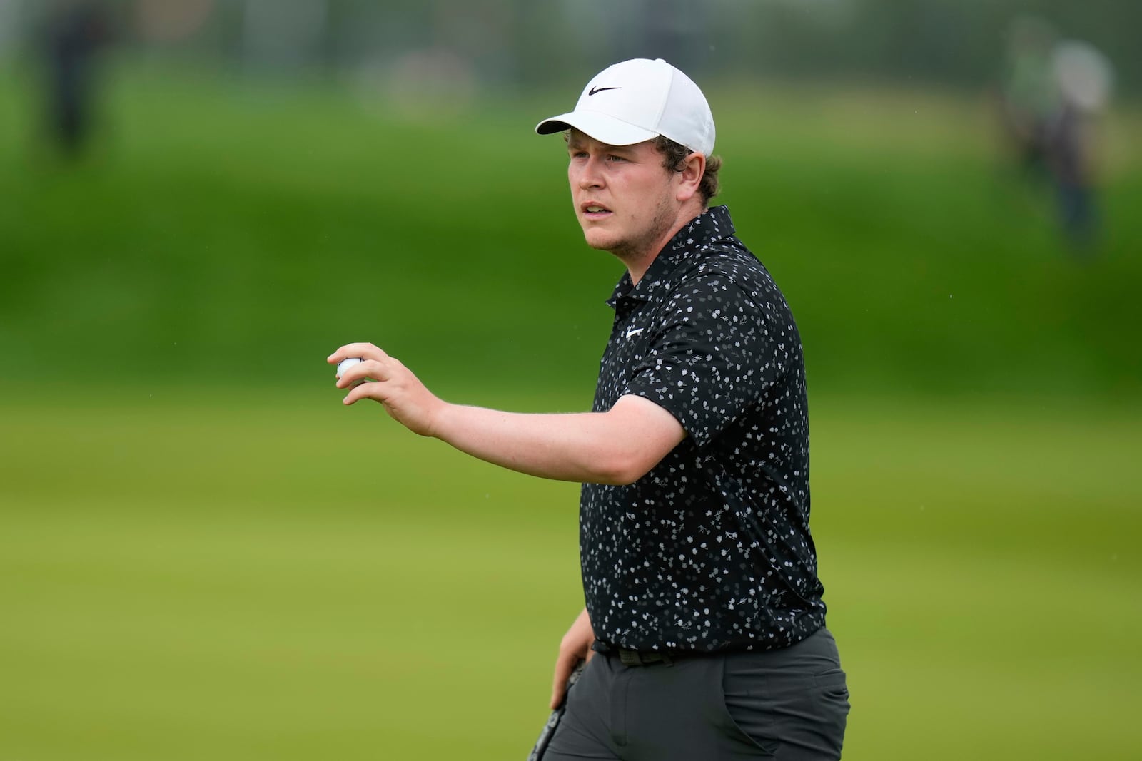 Robert MacIntyre, of Scotland, reacts to his birdie putt on the 14th hole during the final round of the U.S. Open golf tournament at Oakmont Country Club Sunday, June 15, 2025, in Oakmont, Pa. (AP Photo/Seth Wenig)
