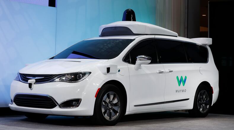 In this Jan. 8, 2017, file photo a Chrysler Pacifica hybrid outfitted with Waymo's suite of sensors and radar is displayed at the North American International Auto Show in Detroit. Right now, there is no car on sale that can drive itself without requiring the driver to pay attention to the road and be prepared to take control of the vehicle. In fact, some automakers have slowed down their timelines. (AP Photo/Paul Sancya, File)