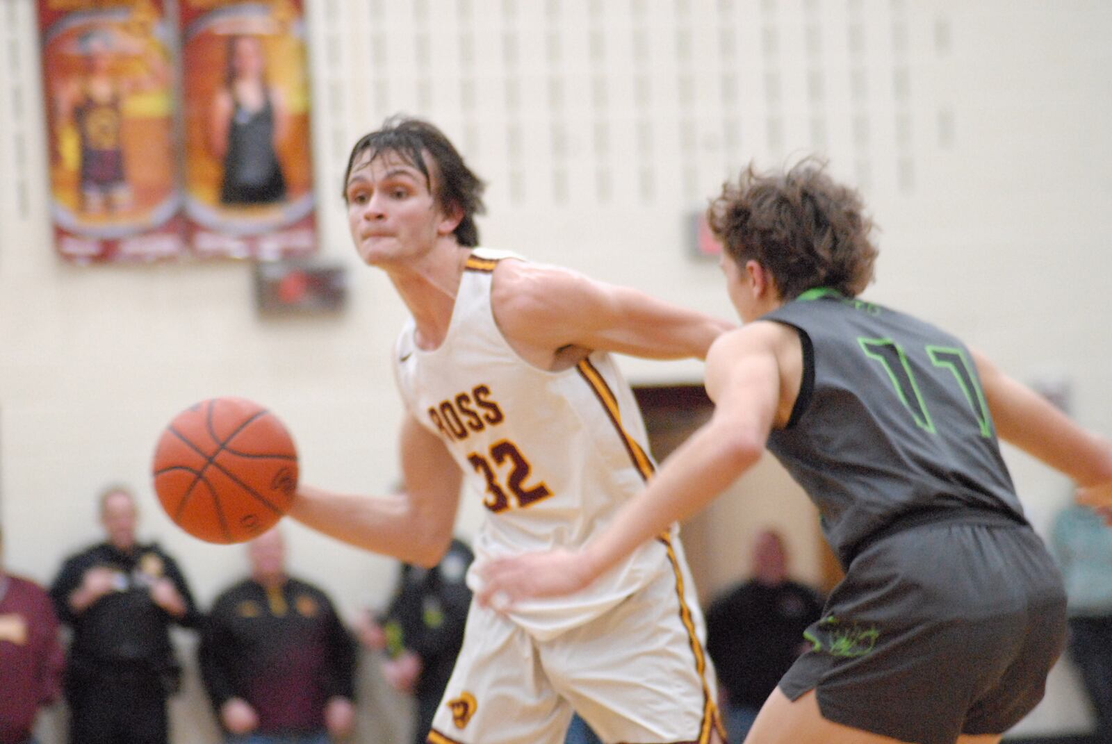Ross senior Kellen Reid (32) is guarded by Badin freshman James Brink (11) during their game on Saturday night at Ross. Chris Vogt/CONTRIBUTED