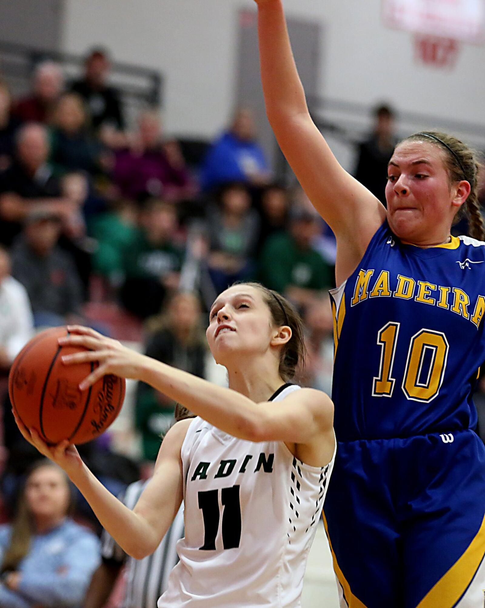 Badin guard Emily Maher tries to get a shot off before Madeira’s Molly Buzek reaches her during a Division III sectional final against Madeira on Saturday afternoon at Fairfield Arena. CONTRIBUTED PHOTO BY E.L. HUBBARD