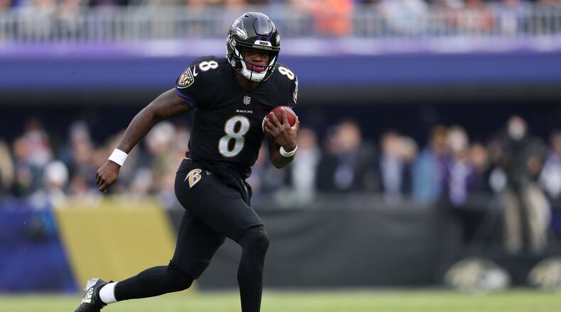 BALTIMORE, MD - NOVEMBER 18: Quarterback Lamar Jackson #8 of the Baltimore Ravens carries the ball in the first quarter against the Cincinnati Bengals at M&T Bank Stadium on November 18, 2018 in Baltimore, Maryland. (Photo by Patrick Smith/Getty Images)