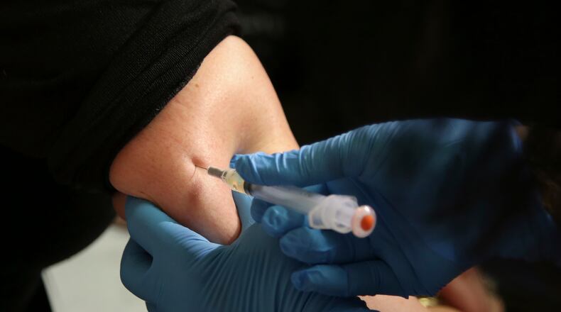 FILE - In this March 27, 2019, file photo, a woman receives a measles, mumps and rubella vaccine at the Rockland County Health Department in Pomona, N.Y. Measles outbreaks in the U.S. and abroad are raising health experts' concern about the preventable, once-common childhood virus. The CDC on April 11, 2024 released a report on recent measles case trends, noting that cases in the first three months of this year were 17 times higher than the average number seen in the first three months of the previous three years. (AP Photo/Seth Wenig, File)