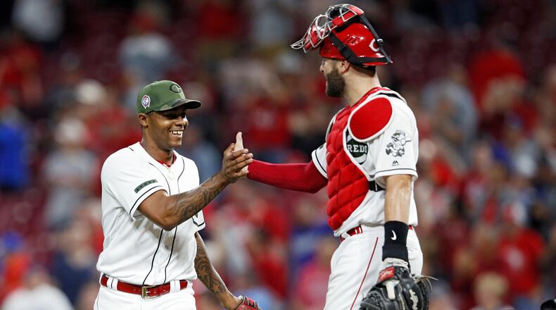CINCINNATI, OH - SEPTEMBER 11: Raisel Iglesias #26 and Curt Casali #38 of the Cincinnati Reds celebrate after the final out in the ninth inning of the game against the Los Angeles Dodgers at Great American Ball Park on September 11, 2018 in Cincinnati, Ohio. The Reds won 3-1. (Photo by Joe Robbins/Getty Images)