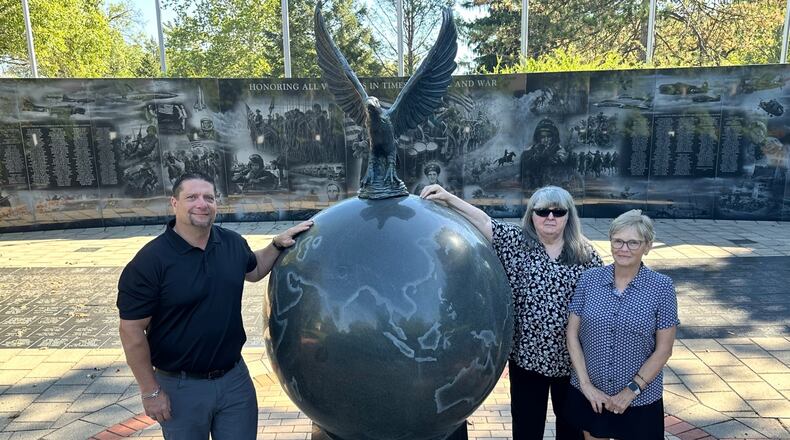 From left, Chair Neil Douglas and committee members Deb Morrison Snider and Lisa George at the Middletown Veterans Memorial. JEFFREY DIVER/CONTRIBUTED