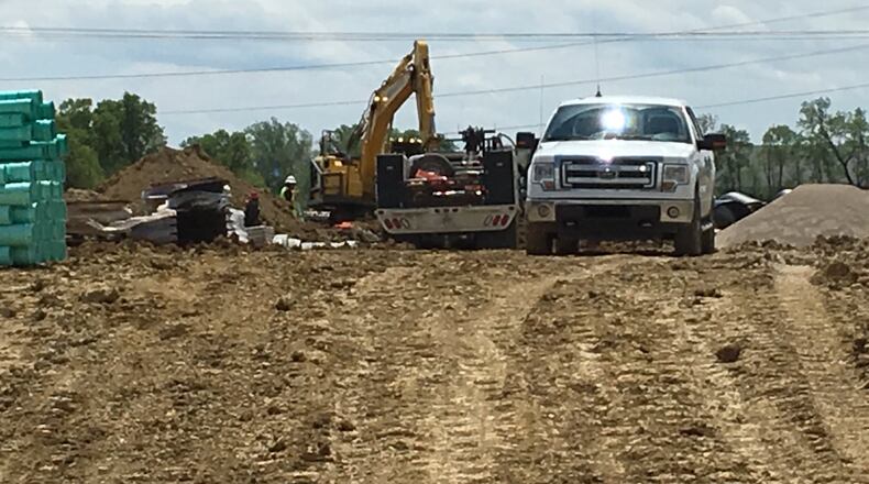 Construction crews continue utility relocation and site preparation for the $1.8 million extension of Salzman Road. The project will benefit the cities of Middletown and Monroe as it would provide a connector for heavy truck traffic between Ohio 63 and Todhunter Road. The project is slated to be completed by the end of 2017. ED RICHTER/STAFF