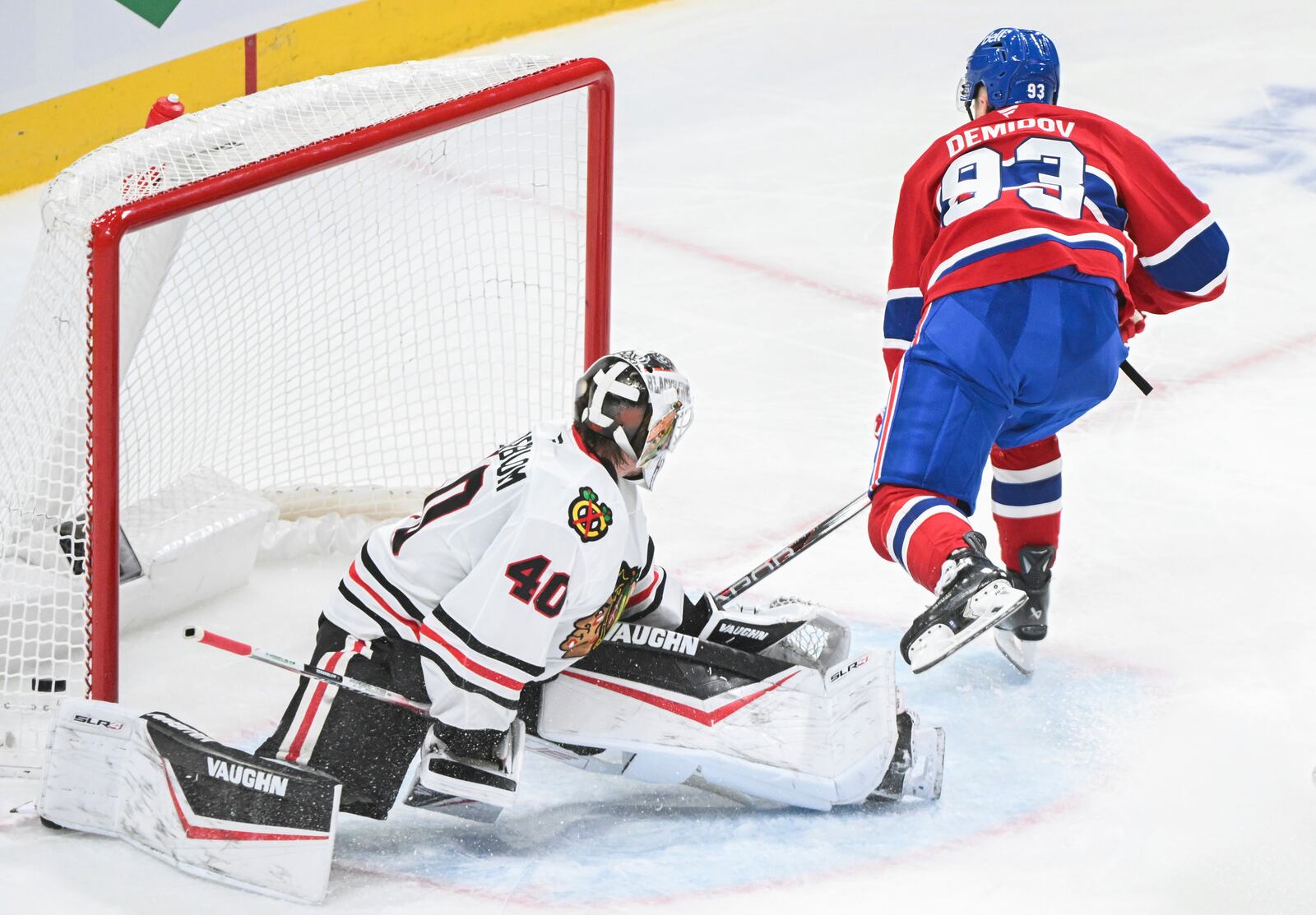 Montreal Canadiens' Ivan Demidov (93) scores against Chicago Blackhawks goaltender Arvid Soderblom (40) during first-period NHL hockey game action in Montreal, Monday, April 14, 2025. (Graham Hughes/The Canadian Press via AP)