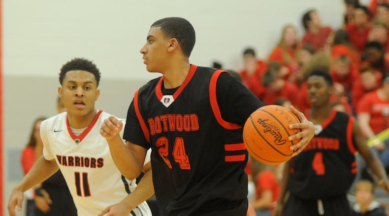Trotwood’s Torrey Patton (with ball) is covered by Wayne’s Rodrick Caldwell. Wayne defeated visiting Trotwood-Madison 82-61 in a boys high school basketball GWOC crossover game on Tuesday, Jan. 26, 2016. MARC PENDLETON / STAFF