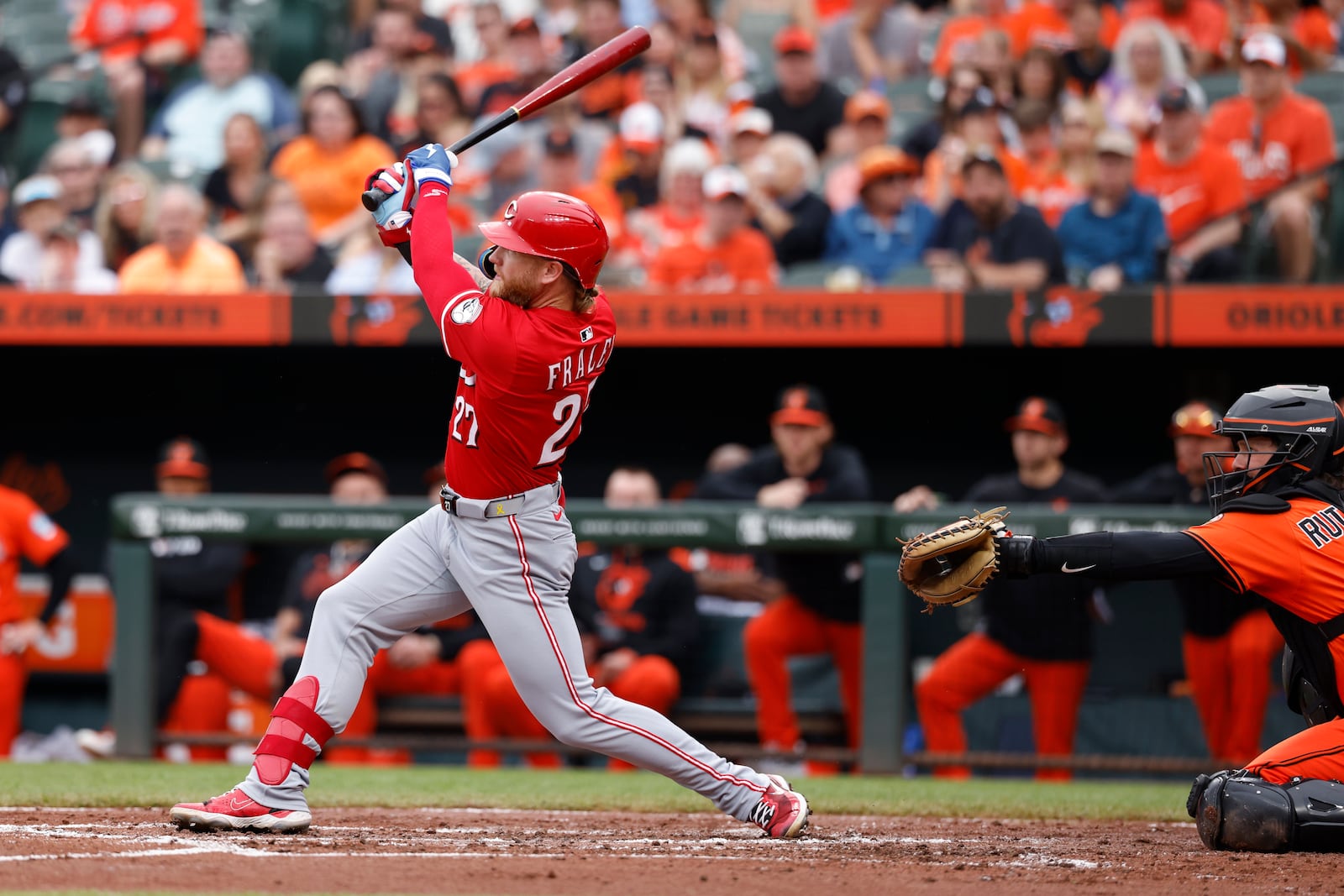 Cincinnati Reds' Jake Fraley (27) hits a solo home run in the second inning of a baseball game against the Baltimore Orioles, Saturday, April 19, 2025, in Baltimore. (AP Photo/Alyssa Howell)