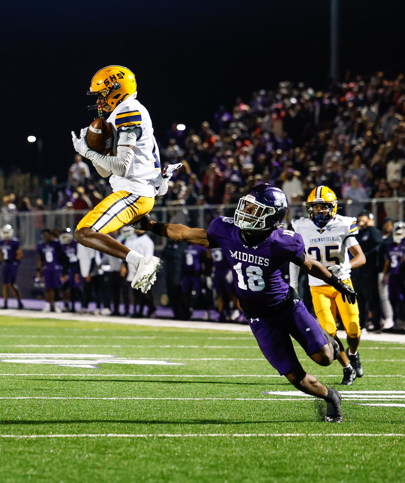 Springfield's Sincere' Keyes intercepts a pass intended for Middletown's Julius Reed during their Division I, regional semifinal playoff football game Friday, Nov. 14, 2025 at Barnitz Stadium in Middletown. The Middies won 14-0 to advance. NICK GRAHAM/STAFF