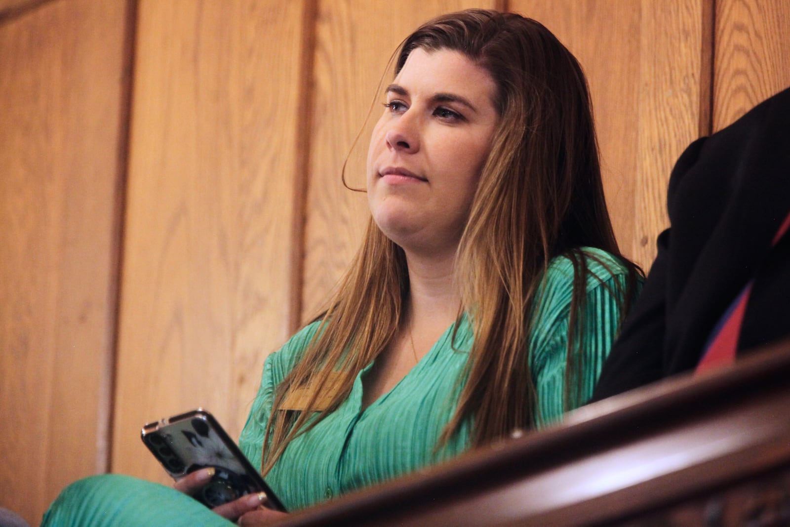 Brittany Jones, policy director for Kansas Family Voice, which opposes abortion, watches from the Senate gallery as Republicans vote to override Democratic Gov. Laura Kelly's veto of a bill granting an income tax break to parents for fetuses and embryos and requiring divorced or single parents to pay child support from conception, Thursday, April 10, 2025, at the Statehouse in Topeka, Kan. (AP Photo/John Hanna)