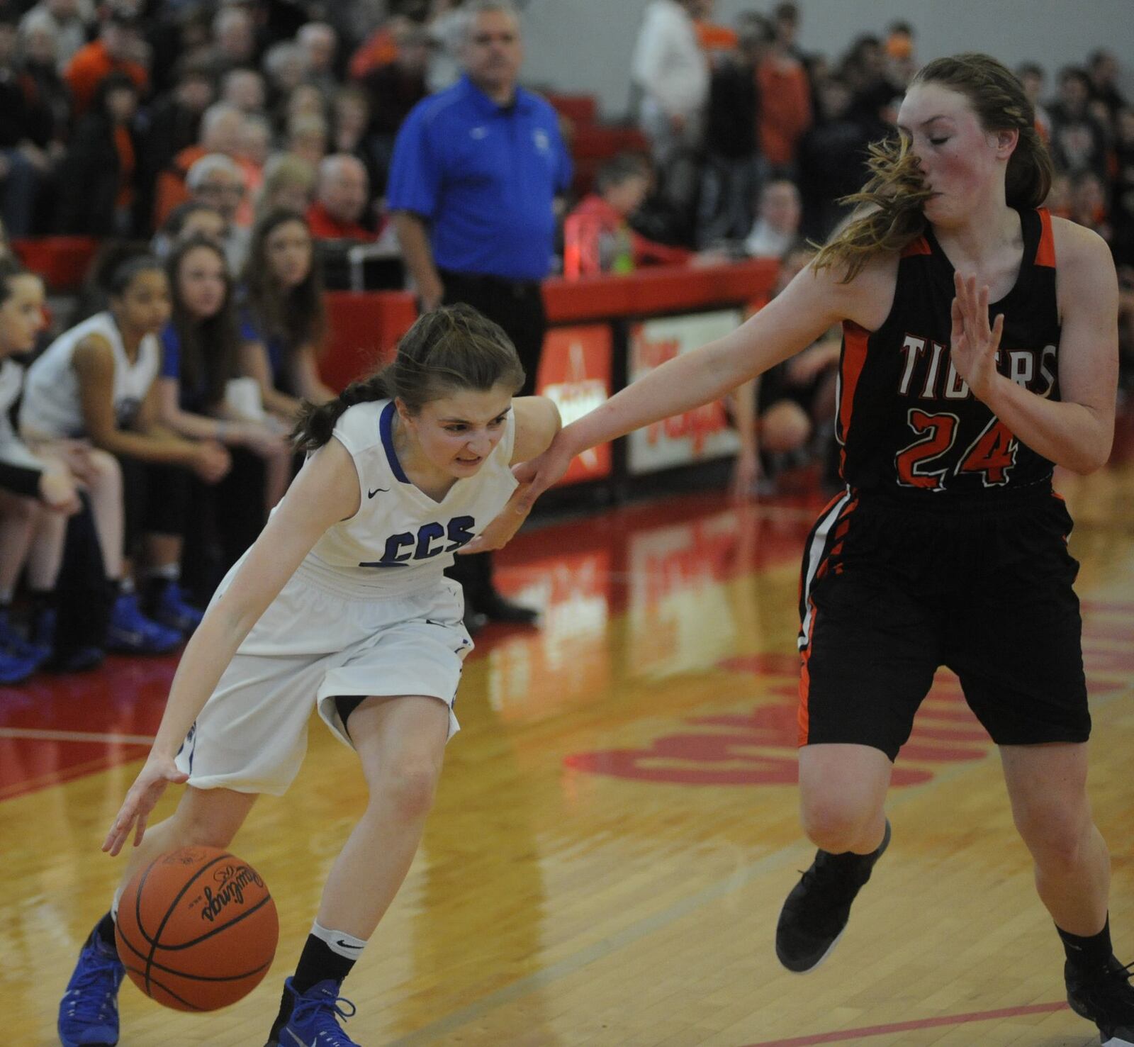 Cincinnati Christian’s Hannah Randall (left) drives on Jackson Center’s Cassie Meyer on Saturday afternoon during a Division IV district final at Troy. MARC PENDLETON/STAFF
