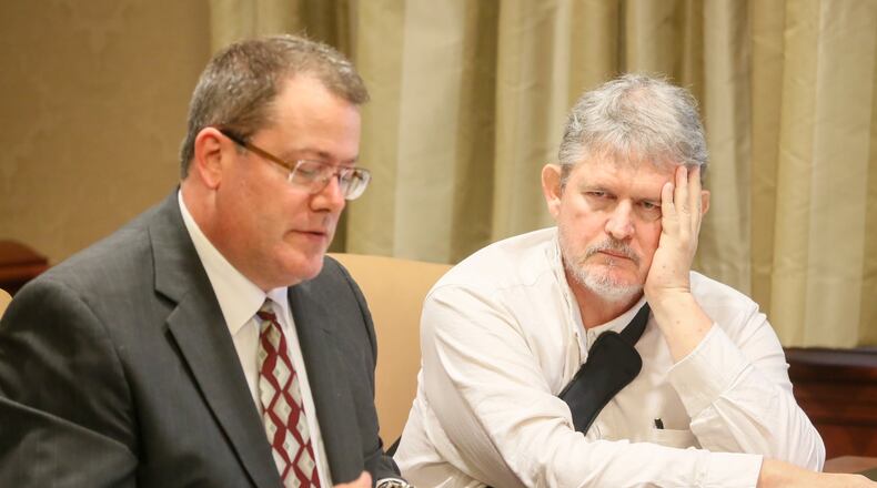 Ross Compton (right), who is accused of setting fire to his $400,000 Middletown home in September, appeared with his attorney Glenn Rossi before Judge Charles Pater in Butler County Court on July 11. Compton’s pacemaker data helped police secure an indictment in this unique case. GREG LYNCH/STAFF