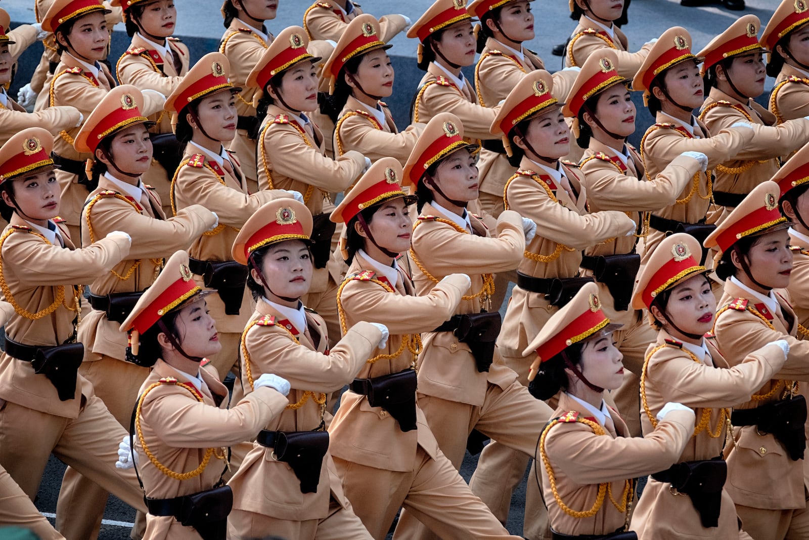 Vietnamese female police officers march during a parade celebrating the 50th anniversary of the end of the Vietnam War on Wednesday, April 30, 2025, in Ho Chi Minh City, Vietnam. (AP Photo/Richard Vogel)