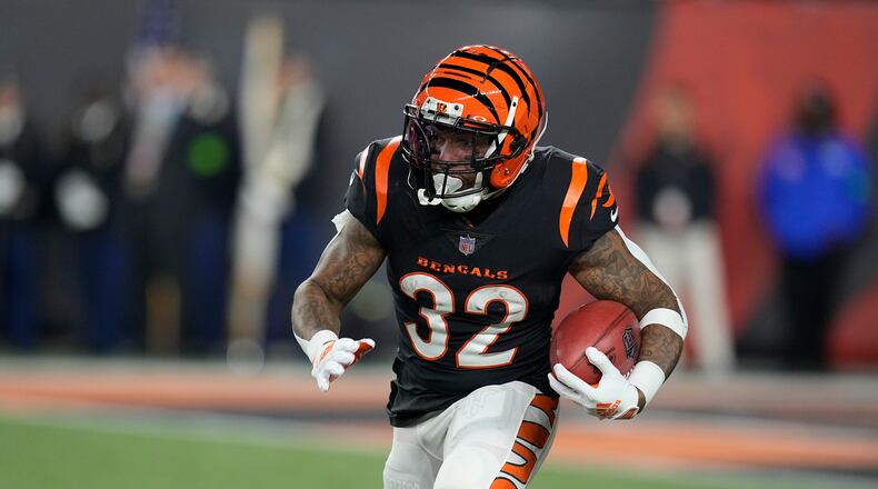 Cincinnati Bengals' Trayveon Williams runs with the ball against the Buffalo Bills during the first half of an NFL football game, Sunday, Nov. 5, 2023, in Cincinnati. (AP Photo/Darron Cummings)