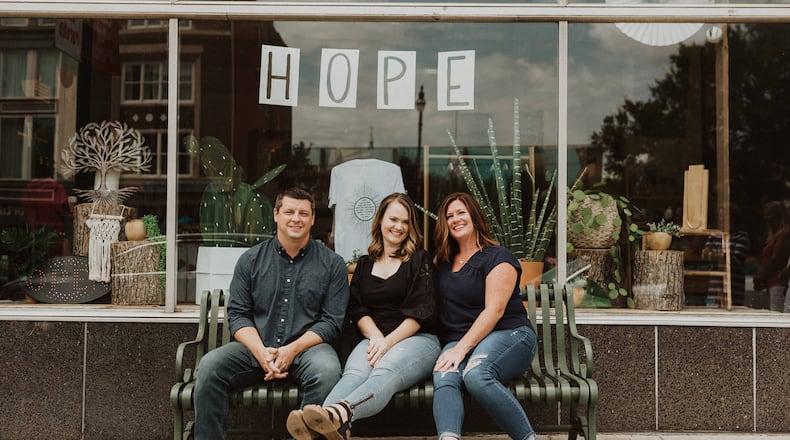 Made to Love on Hamilton’s High Street may look like any one-stop shop for clothes, home goods, and food. But Made to Love, a nonprofit, was uniquely created with a special goal: to benefit Haitian citizens. Pictured, from left, are cofounders Tony Harris, Christin Harris, and Shari Miller. CONTRIBUTED