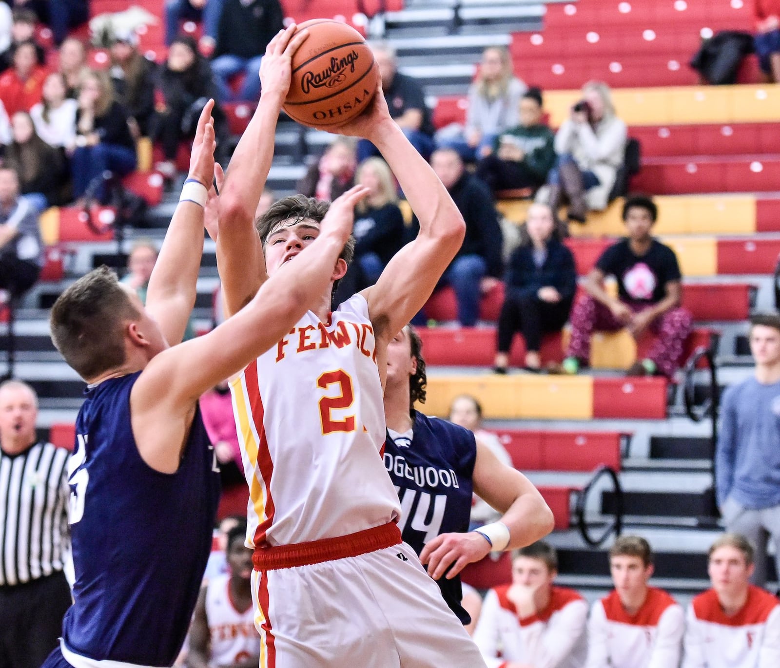 Edgewood’s Trent Allen (15) and Garrett Gabbard (44) defend a shot by Fenwick’s Jonathan Hoerlein during their game Tuesday night at Fenwick. NICK GRAHAM/STAFF