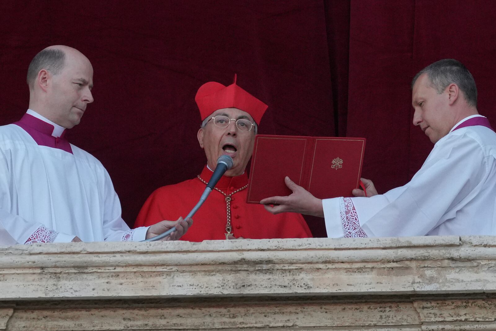Cardinal Dominique Mamberti announces the election of the new pope, at the Vatican, Thursday, May 8, 2025. (AP Photo/Andrew Medichini)