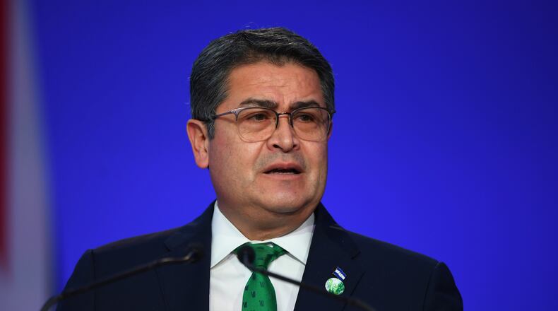 FILE - Honduras' President Juan Orlando Hernandez speaks during the opening ceremony of the UN Climate Change Conference COP26 in Glasgow, Scotland, Monday Nov. 1, 2021. Andy Buchanan/Pool via AP, File)