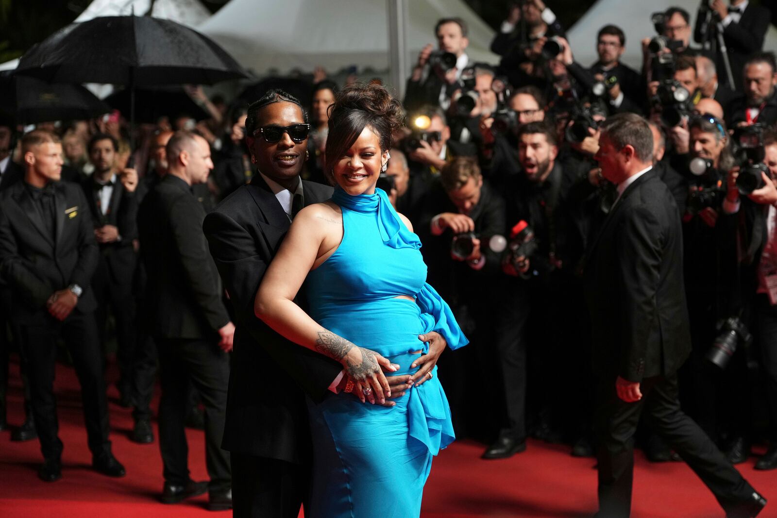 A$AP Rocky, left, and Rihanna pose for photographers upon departure from the premiere of the film 'Highest 2 Lowest' at the 78th international film festival, Cannes, southern France, Monday, May 19, 2025. (Photo by Lewis Joly/Invision/AP)