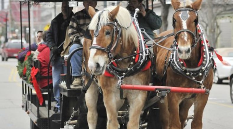 An image from the German Village Christmas Walk in Hamilton. The annual walk gives people the opportunity to view some of the historical houses in the village as well as carriage rides, face painting, visiting Santa and music at several different locations.