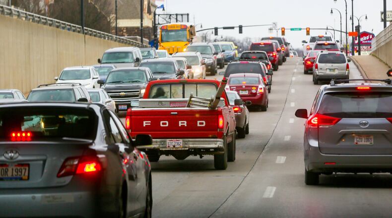 Hamilton will go ahead with planned tweaks of traffic signals along the High-Main corridor through downtown, but will have traffic consultants on hand to change the signals immediately if backups ensue on side streets. GREG LYNCH / STAFF