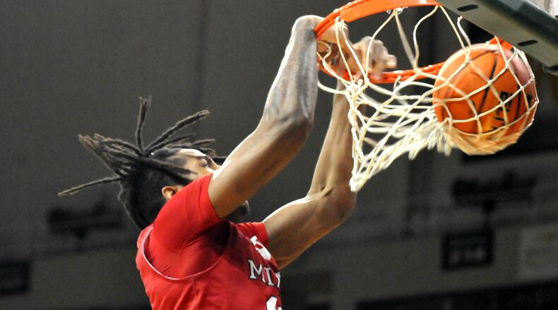 Miami's Mekhi Cooper, 11, jams the ball home for two points during the first half of a nonconference game at Wright State University on Tuesday, Dec.19. 2023. Cooper had nine points in Saturday's win over Eastern Michigan.. DAVID A. MOODIE/CONTRIBUTING PHOTOGRAPHER