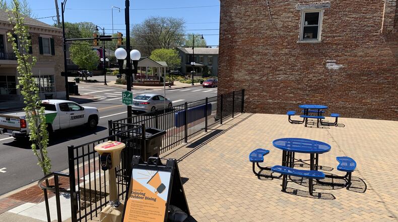 Hamilton city employees and parks conservancy workers created some new seating areas, along with hand-sanitizer stations, in the Downtown and Main Street areas, with some recommendations for physical distancing. PROVIDED