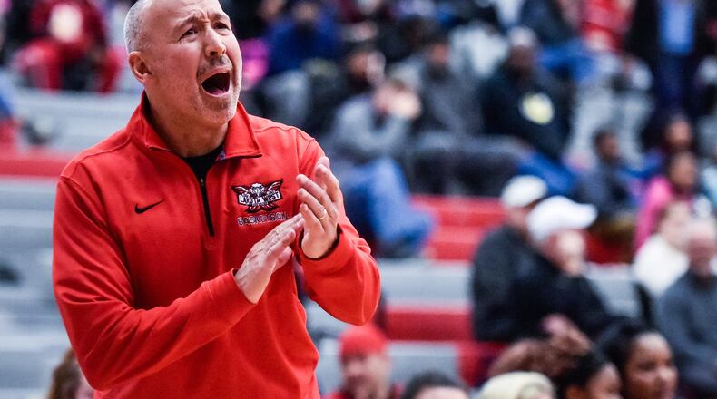 Lakota West coach Andy Fishman encourages his team during a 61-50 win at Princeton on Jan. 16. It was the 400th win of Fishman’s coaching career. NICK GRAHAM/STAFF