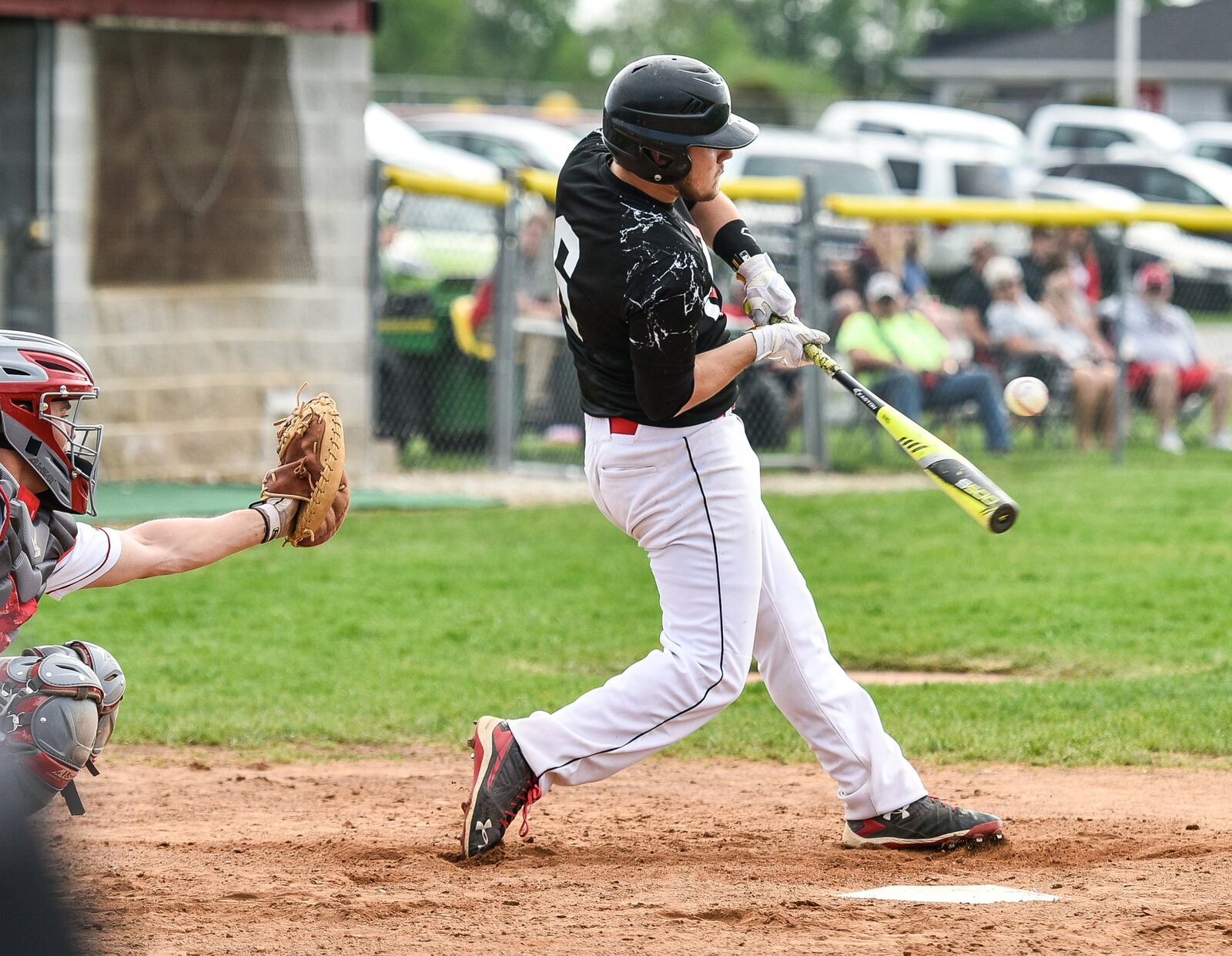 Preble Shawnee’s Bo Higgins gets a piece of the ball Wednesday during a Division III sectional contest against Carlisle at Sam Franks Field in Carlisle. NICK GRAHAM/STAFF