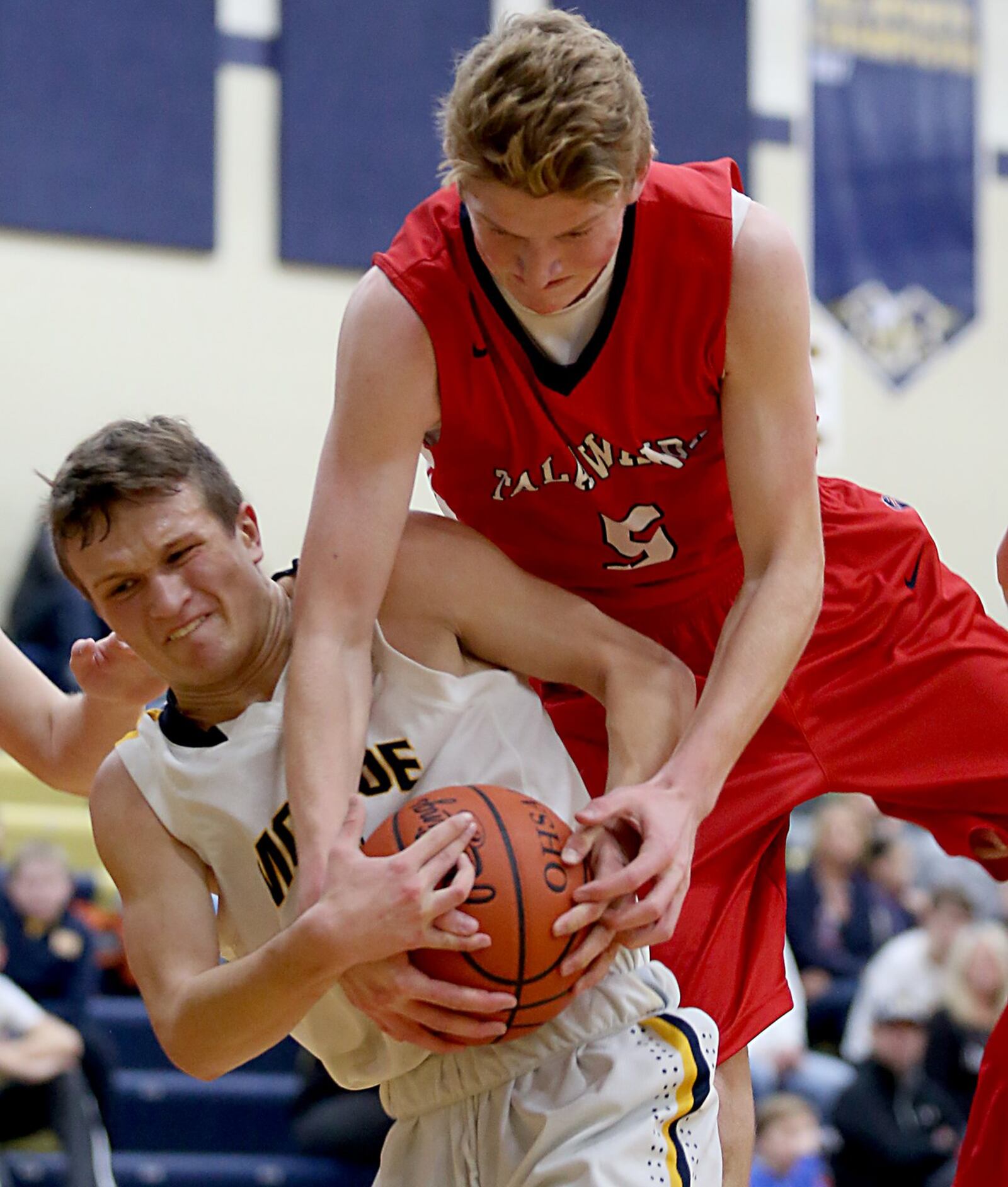 Monroe’s Thryceton Deckard (left) and Talawanda’s Blake Cooke battle for a rebound during their game at Monroe on Tuesday night. CONTRIBUTED PHOTO BY E.L. HUBBARD