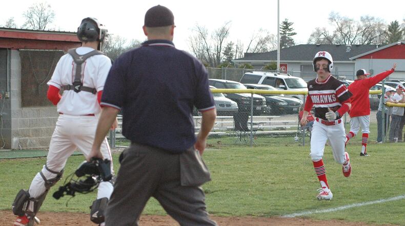 Madison’s Justin Gray is about to score the only run as Carlisle catcher Nolan Burney watches the ball Monday during a 1-0 Southwestern Buckeye League baseball victory by visiting MHS at Sam Franks Field. RICK CASSANO/STAFF