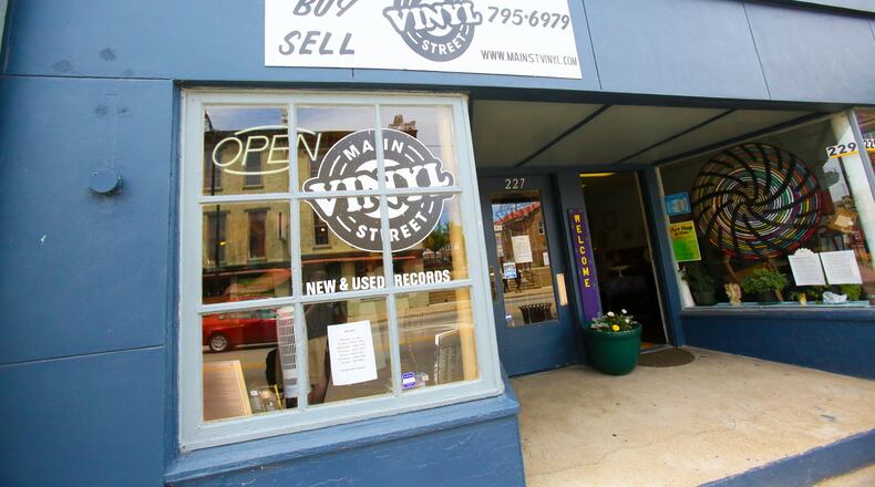 The new Main Street Vinyl sign will be centered over the shop, which now is about twice as large as earlier, after it expanded into an adjoining space. GREG LYNCH/STAFF