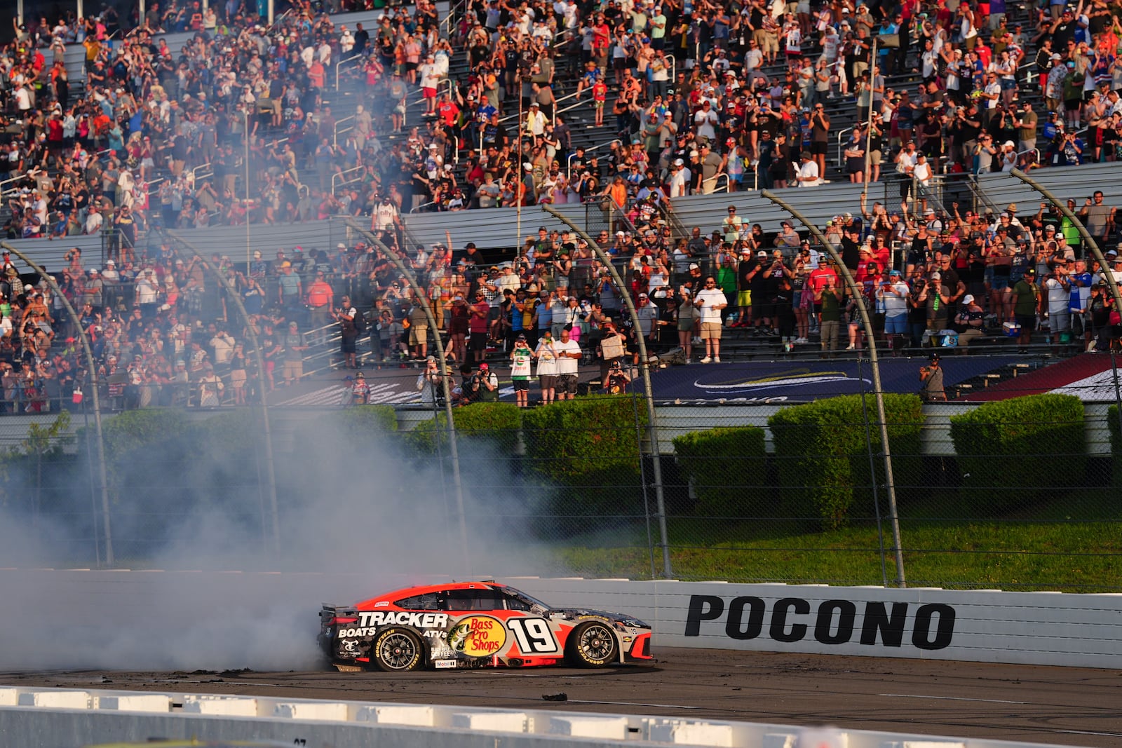 Chase Briscoe celebrates with a burnout after winning a NASCAR Cup Series auto race at Pocono Raceway, Sunday, June 22, 2025, in Long Pond, Pa. (AP Photo/Derik Hamilton)
