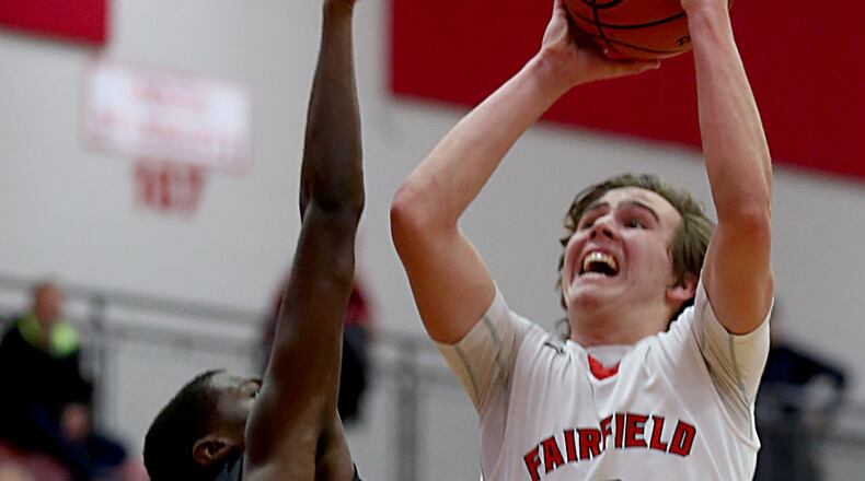 Fairfield guard Drew O’Donnell shoots while being covered by Colerain’s Cass Carter during their game at Fairfield Arena on Tuesday night. CONTRIBUTED PHOTO BY E.L. HUBBARD