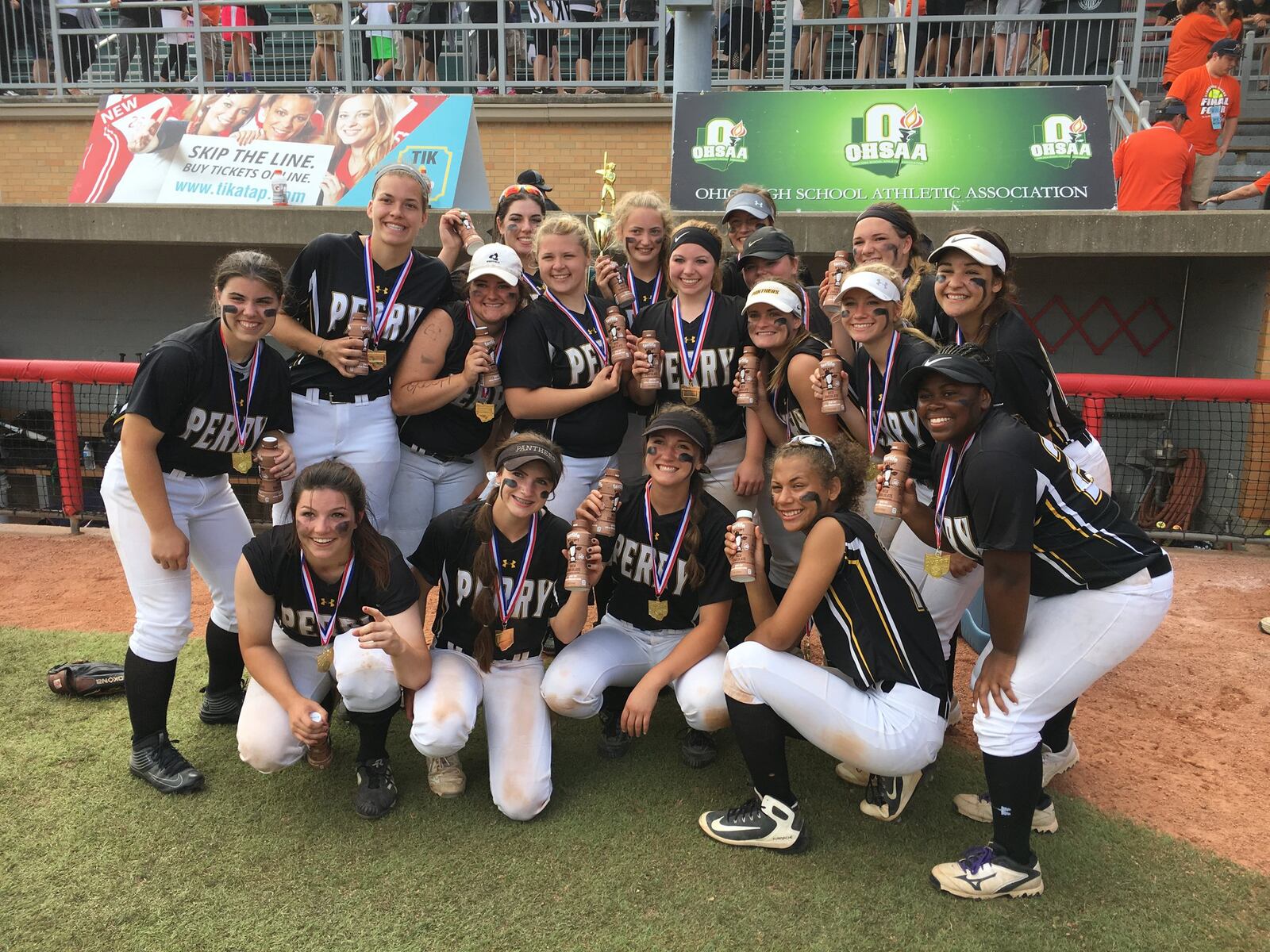 The Massillon Perry Panthers pose with their victory drinks Saturday after beating Lakota West 11-1 to win the Division I state championship at Firestone Stadium in Akron. RICK CASSANO/STAFF