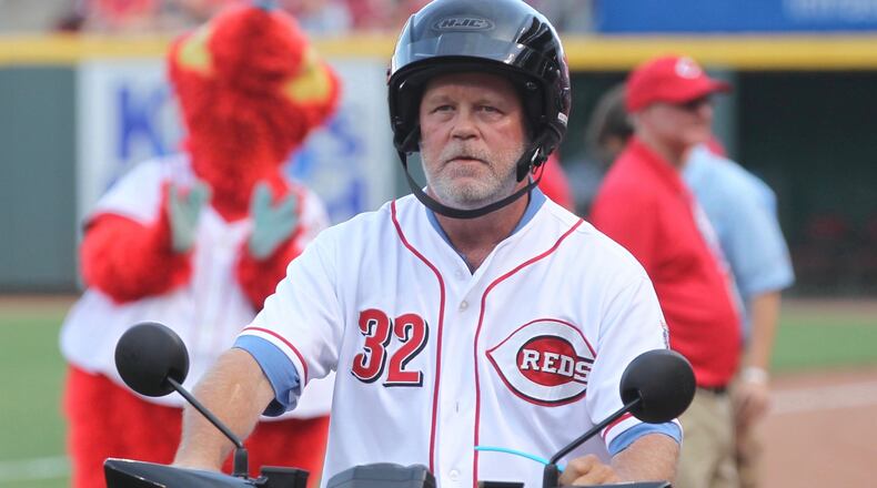 Former Reds pitcher Tom Browning rides a scooter past the dugout during a ceremony honoring Scooter Gennett before a game against the Dodgers on Friday, June 16, 2017, at Great American Ball Park in Cincinnati. FILE