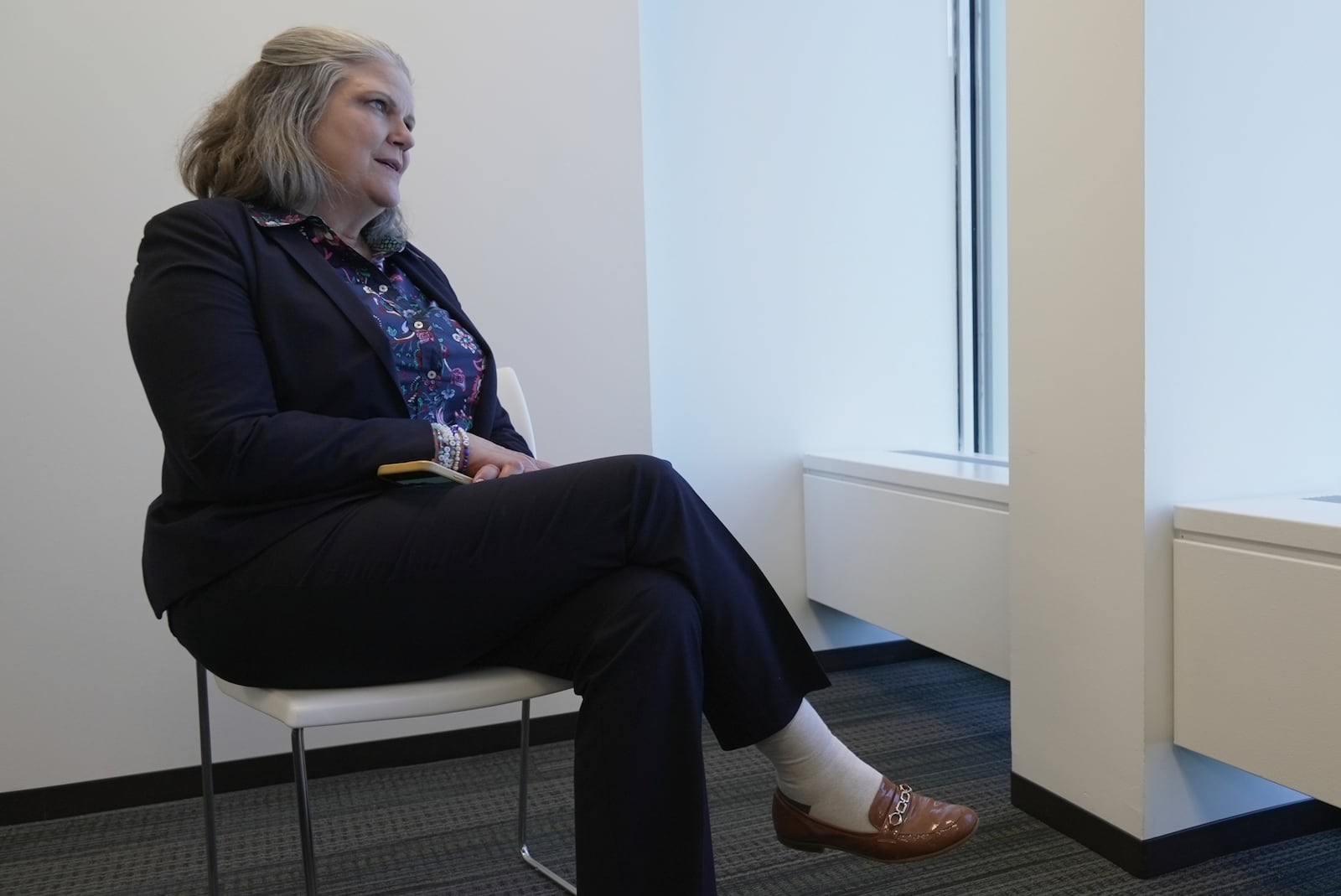 Jennifer Peyton sits for an interview in downtown Chicago on July 21, 2025. (AP Photo/Laura Bargfeld)