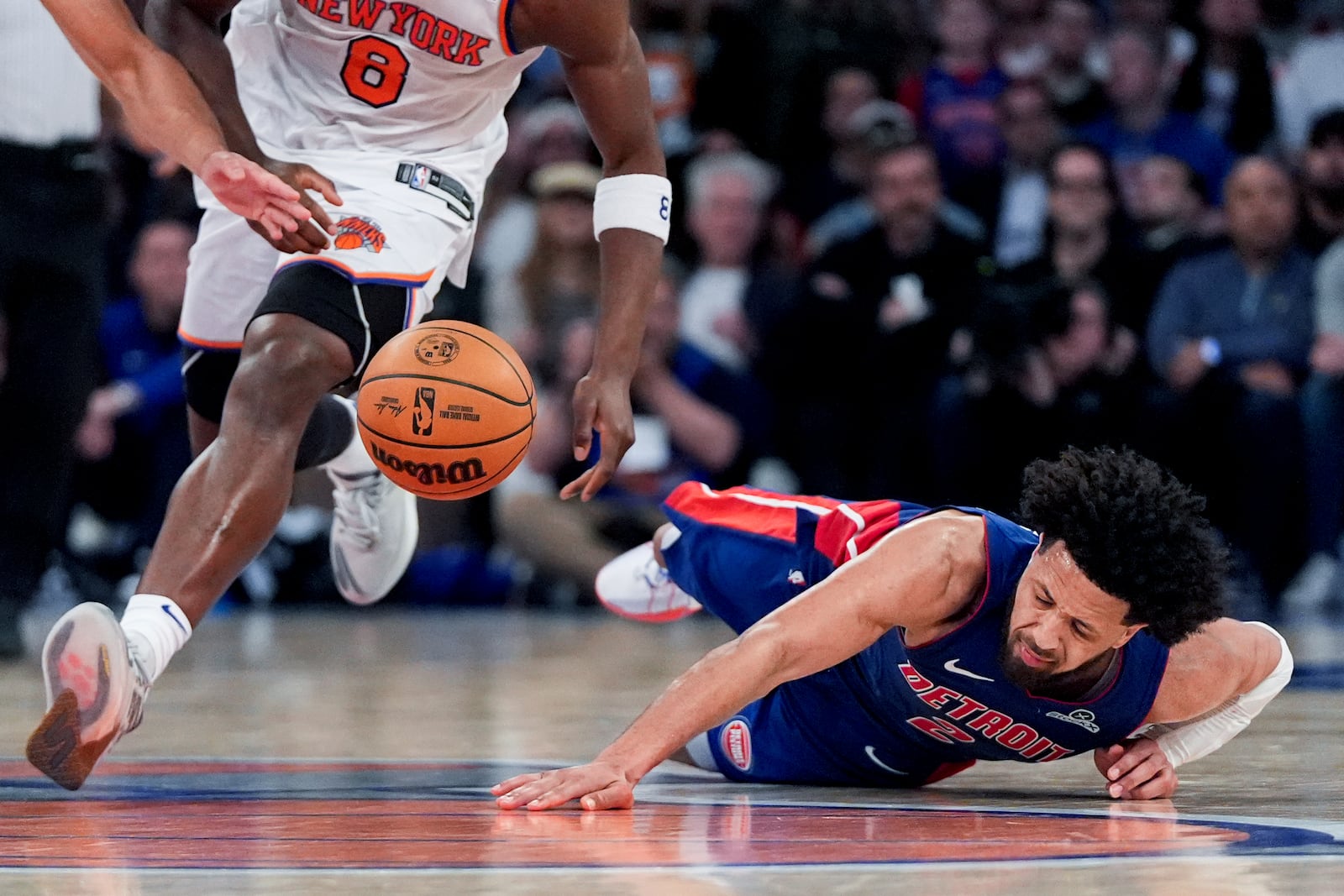Detroit Pistons guard Cade Cunningham (2) falls during the second half of Game 1 in an NBA basketball first-round playoff series against the New York Knicks, Saturday, April 19, 2025, in New York. (AP Photo/Julia Demaree Nikhinson)