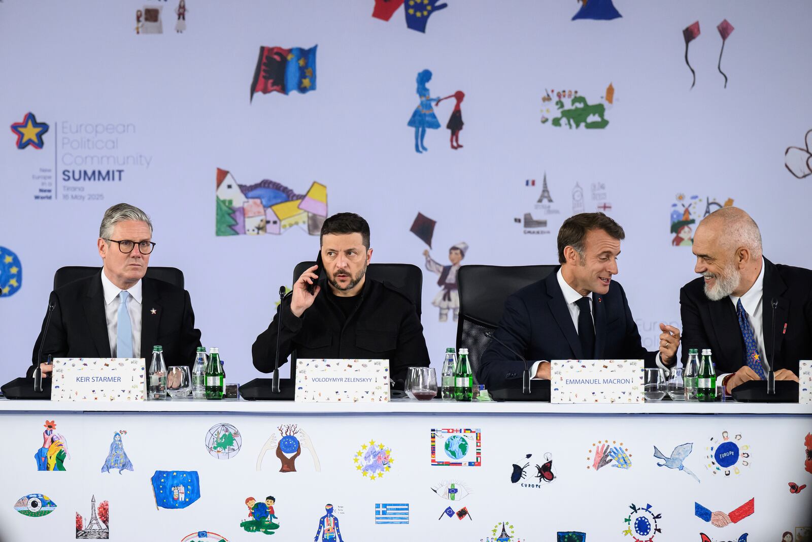 From left, Britain's Prime Minister Keir Starmer, Ukraine's President Volodymyr Zelenskyy, France's President Emmanuel Macron and Albania's Prime Minister Edi Rama attend a plenary meeting at the beginning of a summit where the leaders of 47 European countries and organizations will discuss security, defense and democratic standards, in Tirana, Albania, Friday, May 16, 2025. (Leon Neal/Pool via AP)