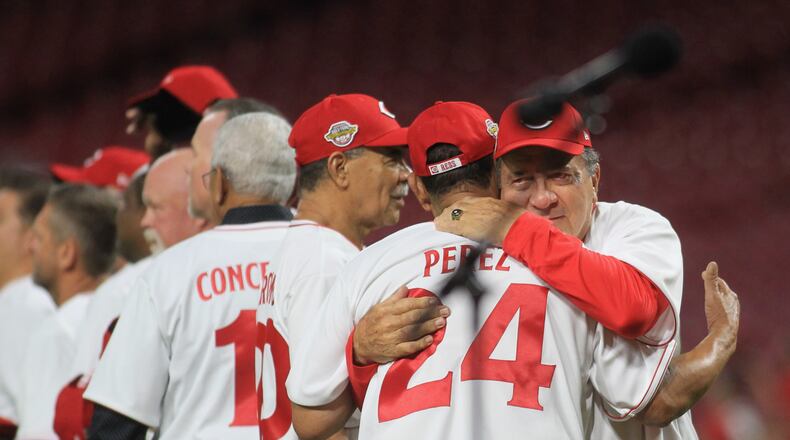 Johnny Bench hugs Tony Perez before the Cincinnati Reds Legends Game at Great American Ball Park on Friday, Aug. 27, 2021, at Great American Ball Park. David Jablonski/Staff