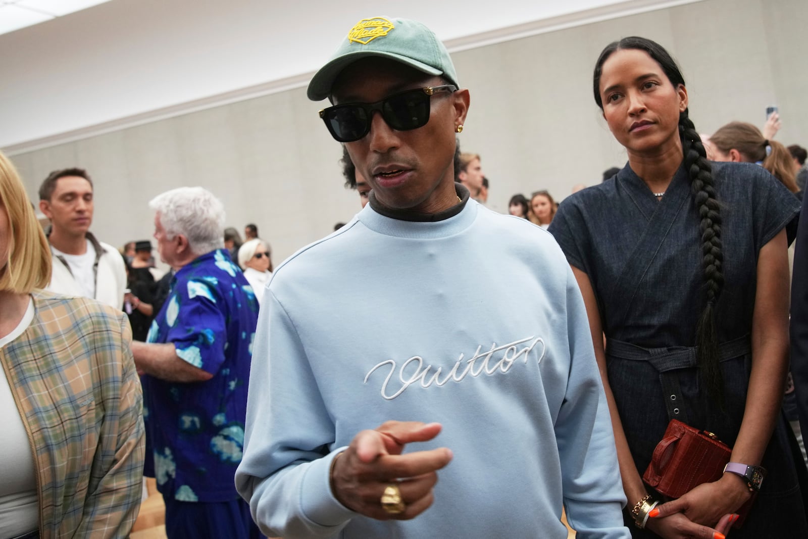 Pharrell Williams attends Dior Homme Spring-Summer 2026 collection, that was presented in Paris Friday, June 27, 2025. (AP Photo/Christophe Ena)