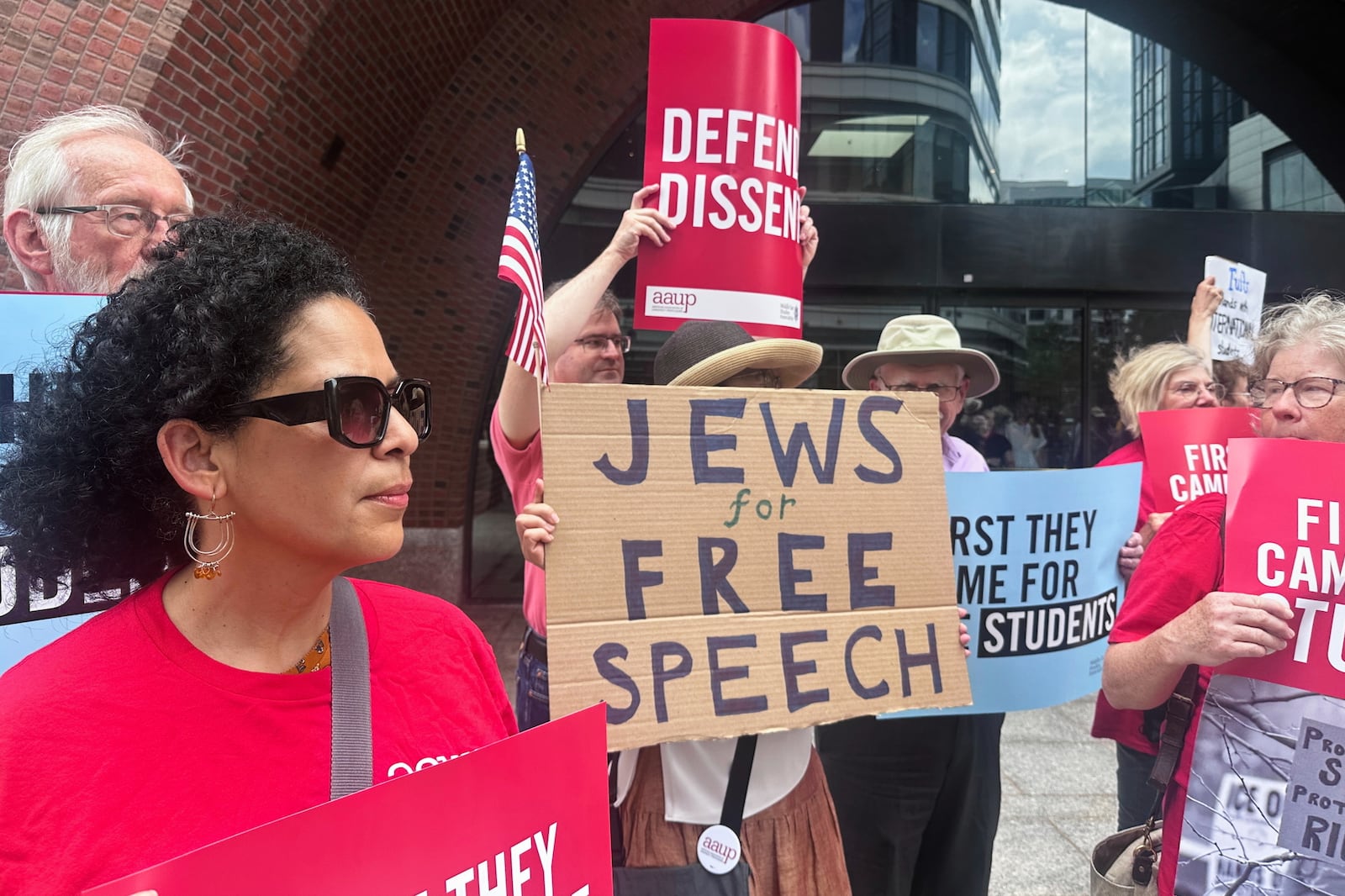 People show their support for a lawsuit challenging the Trump administration's policy of targeting students for deportation who took part in pro-Palestinian demonstrations on Monday, July 7, 2025, at the federal courthouse in Boston. (AP Photo/Michael Casey)