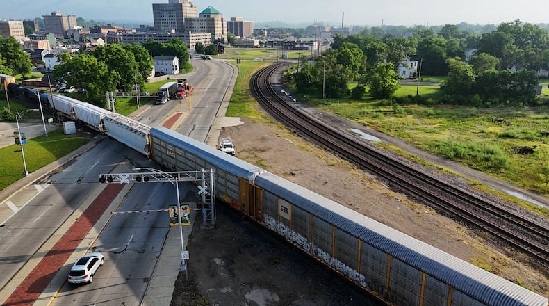 Two train cars derailed as a train passed through Hamilton on Thursday night, June 5, 2025. No one was injured. Officials and workers were still at the scene Friday morning to get the train back on track as multiple crossings in the city were blocked. NICK GRAHAM/STAFF