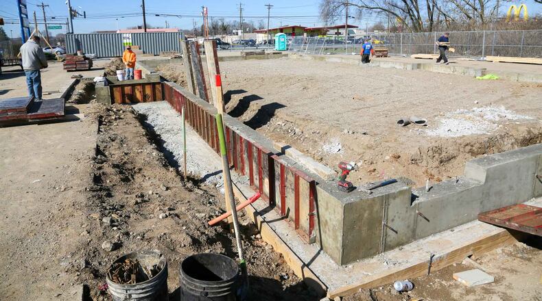 Construction workers are in the early stages of rebuilding the Skyline Chili Restaurant that burned down last year in Fairfield. GREG LYNCH / STAFF
