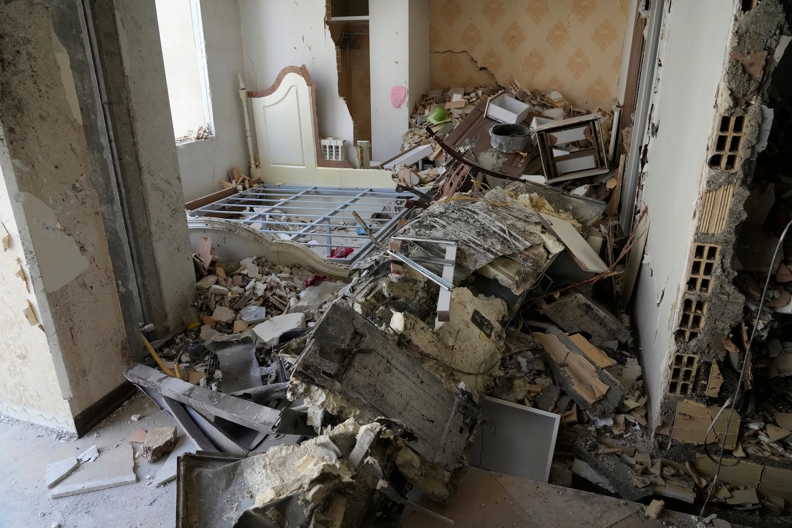 Damages of a building are seen in Tehran, Iran, Wednesday, June 25, 2025, after an Israeli strike on early Tuesday. (AP Photo/Vahid Salemi)