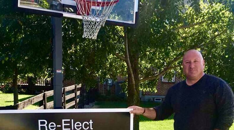 Former Lebanon School Board Member Brian DeGennaro stands in front of the type of sign he was prevented from posting where he and his supporters wanted to during his re-election loss.