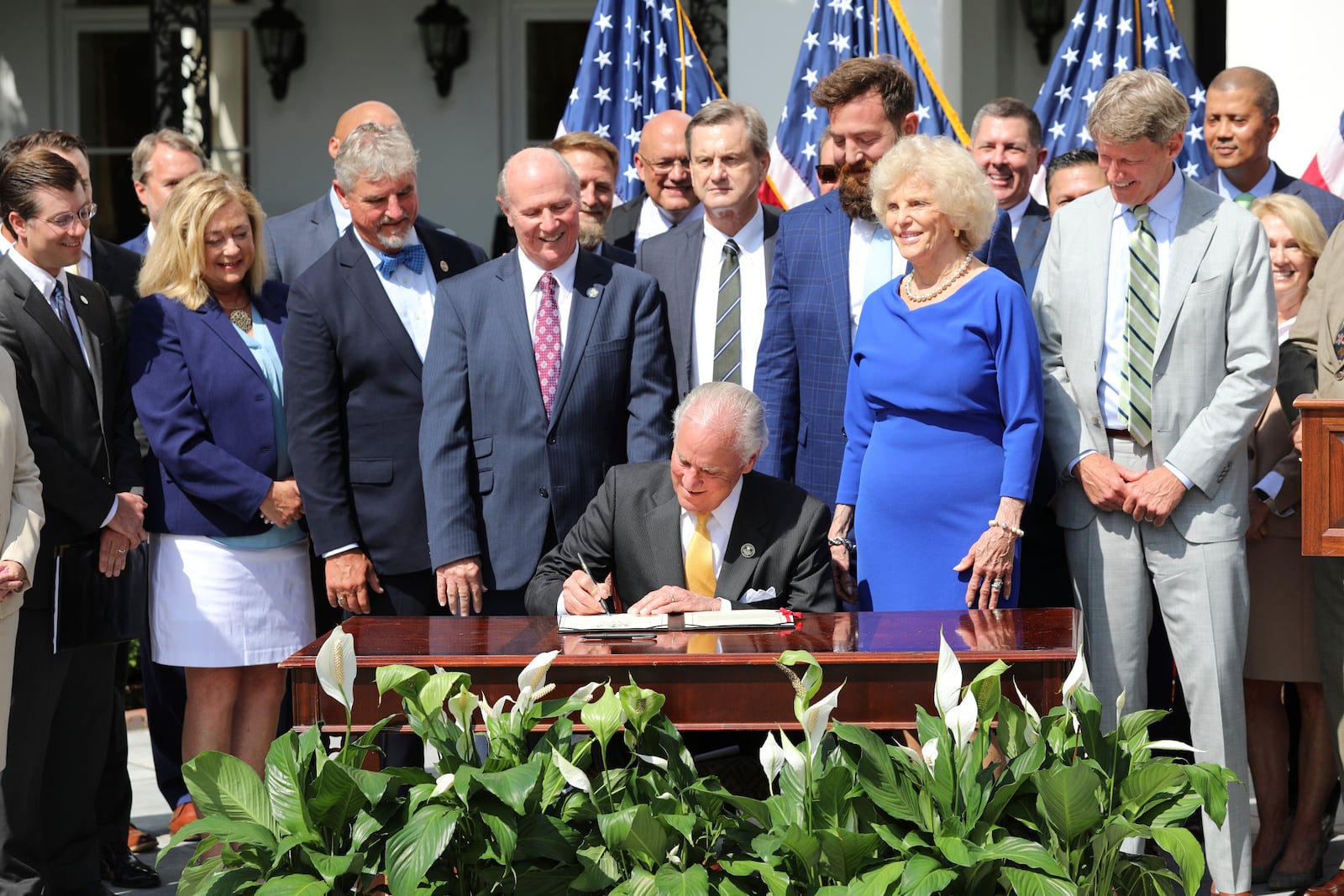 Republican South Carolina Gov. Henry McMaster signs a ceremonial copy of a bill he signed changing South Carolina's energy laws on Wednesday, June 18, 2025, in Columbia, S.C. (AP Photo/Jeffrey Collins)